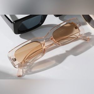 Clear pink/peach sunglasses as seen in photo